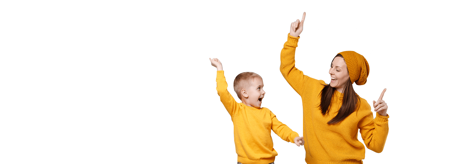 A caregiver and young child in yellow dancing together in an official Zumbini promotional image.